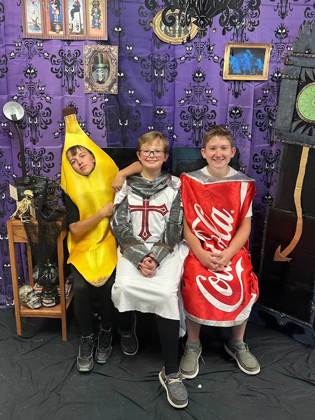 7th grade guys dress up as a banana, a Medieval knight, and a Coca-cola can