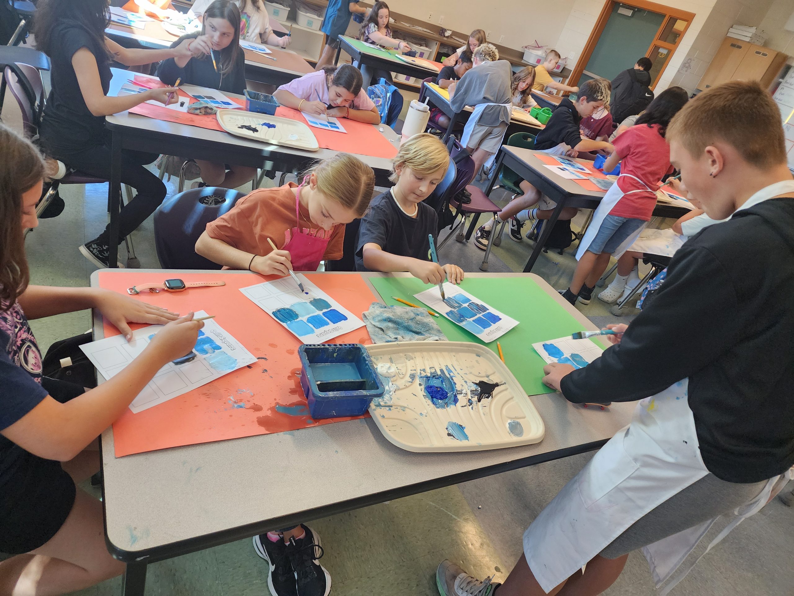 Ms. Bulkley's class learns how to mix shades and tints to make a monochromatic palette during art class.