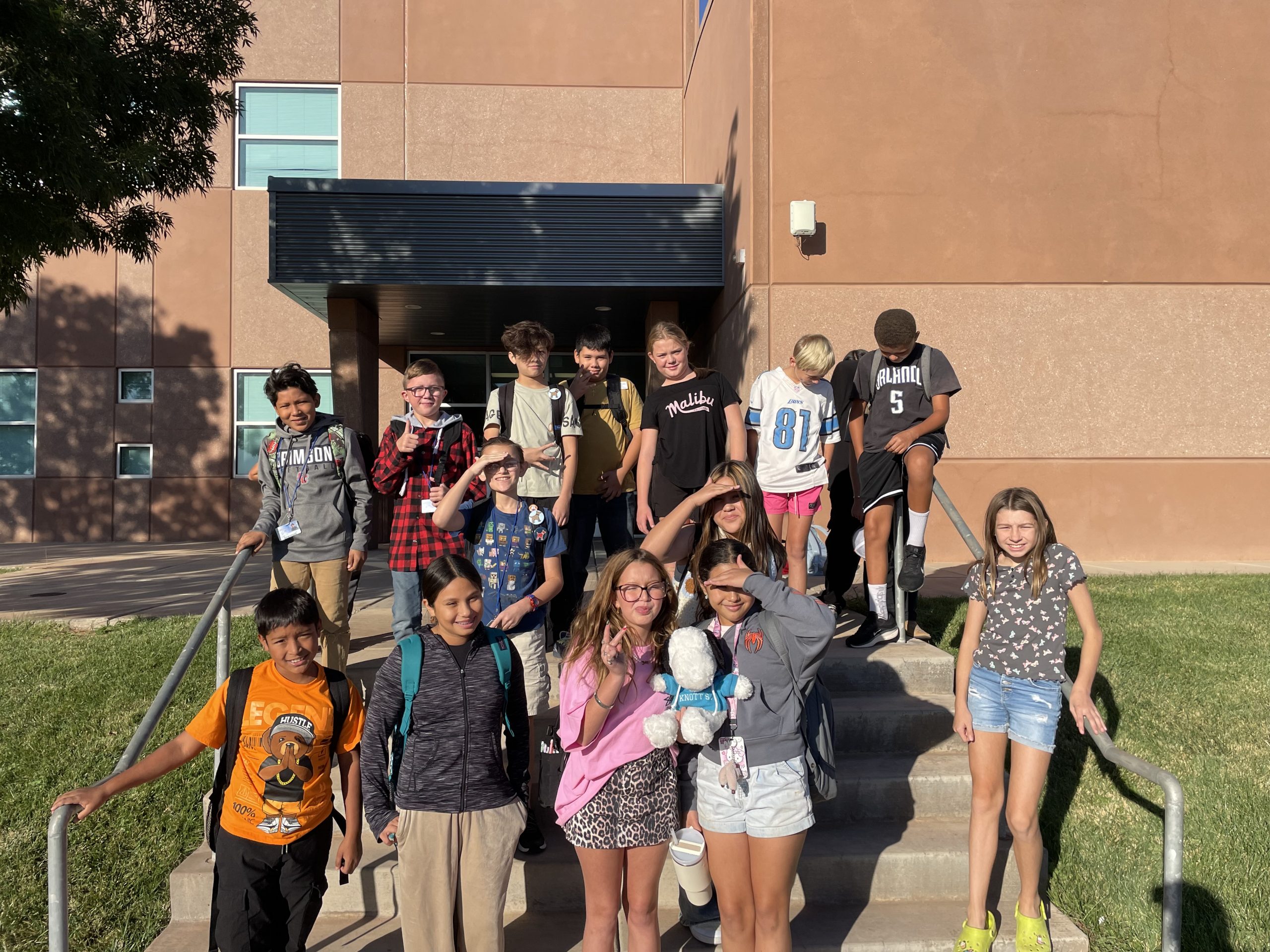 Ms. Watson's homeroom class enjoy some sunshine outside.