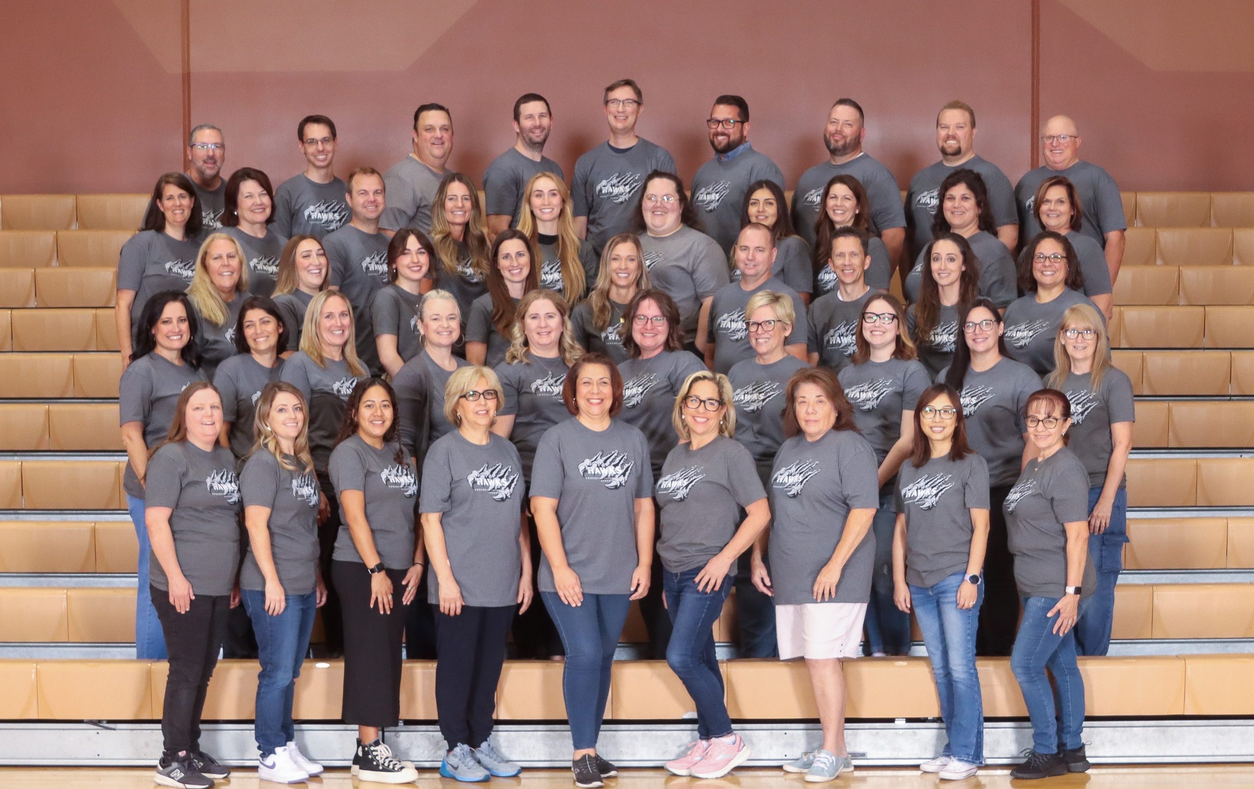 Tonaquint Staff picture on bleachers in the gym